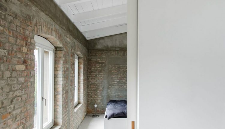 Bedroom-has-the-same-exposed-brick-walls